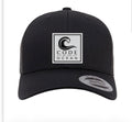 Trucker hat in black with square Code of the Ocean logo